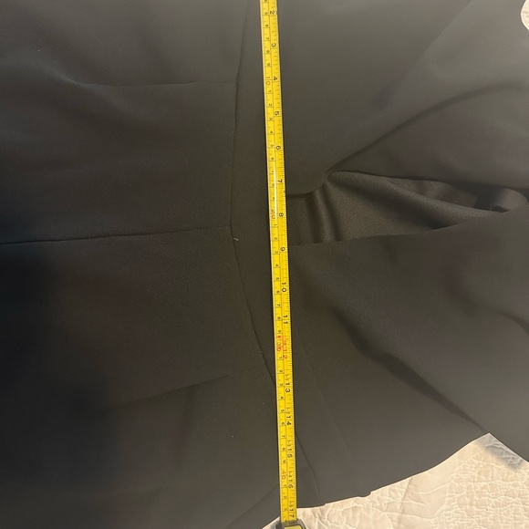 Express Black stretch jumpsuit. Low v neck front & opening below breast line. - Picture 7 of 9